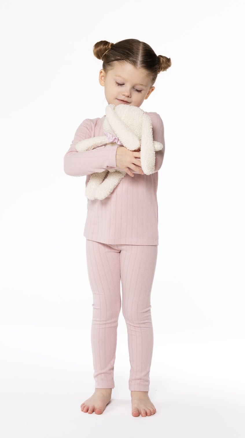 Kids long johns sewing pattern – full body view, girl holding bunny, We Nordics pattern by Dear Billy Patterns