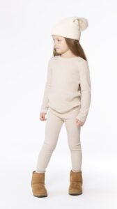 Kids long johns sewing pattern – full body view in beige knit, winter outfit with hat, We Nordics pattern by Dear Billy Patterns