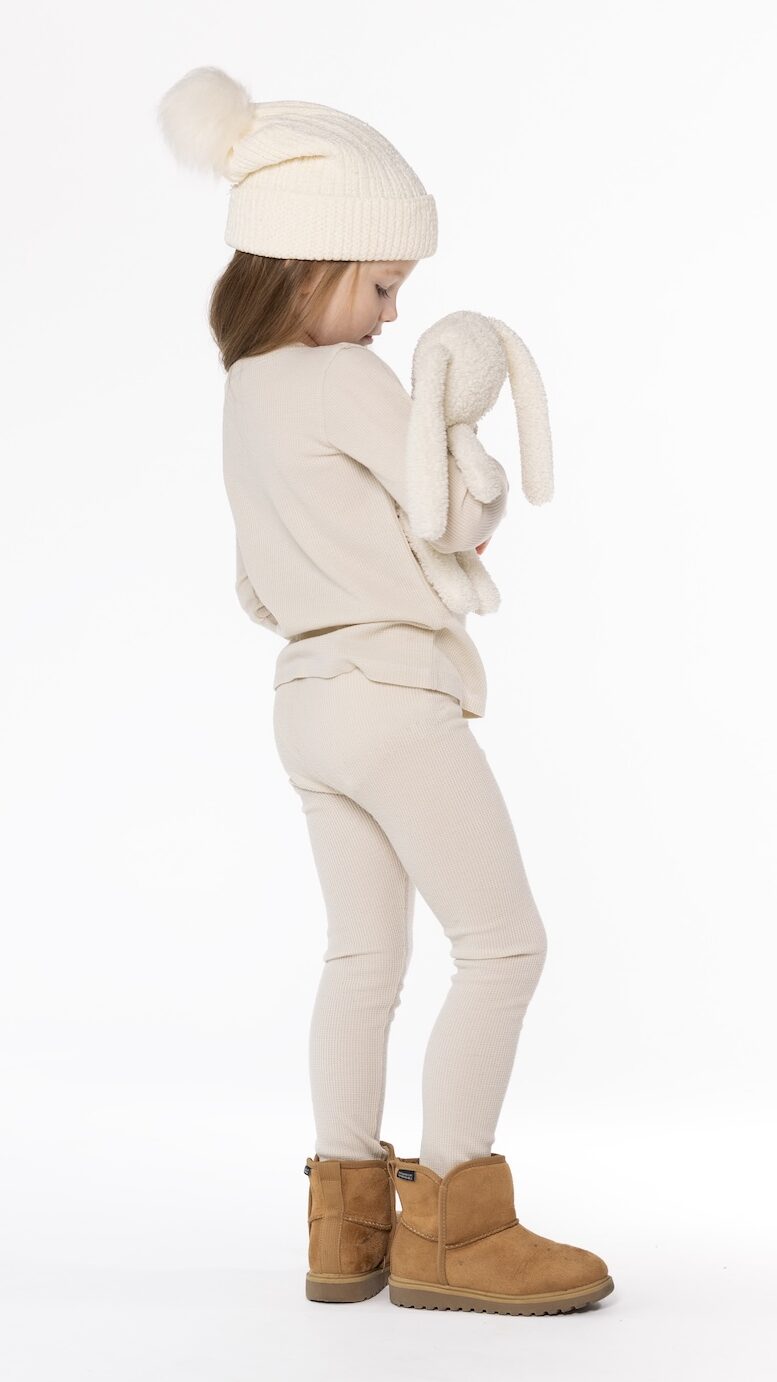 Kids long johns sewing pattern – side view of child wearing knit thermal set – We Nordics pattern by Dear Billy Patterns