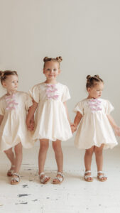 Bubble hem puff dress with front bows, girls sewing pattern for woven fabrics