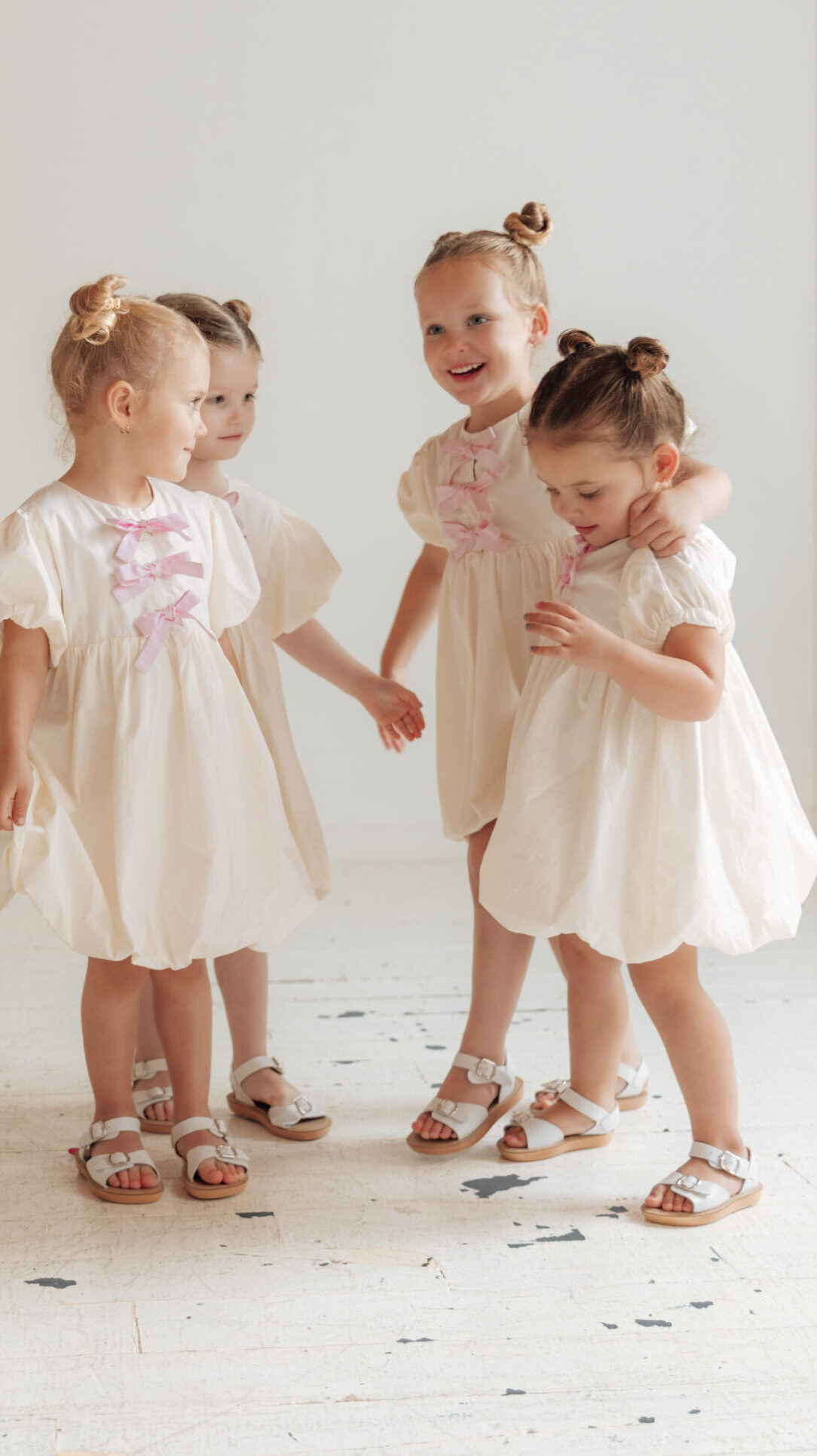 Bubble hem girls dress pattern with puff sleeves and bows
