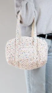 Mini duffel bag sewing pattern shown on body