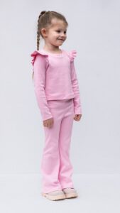 Long sleeve girls top with shoulder ruffle detail from Darling lounge set sewing pattern