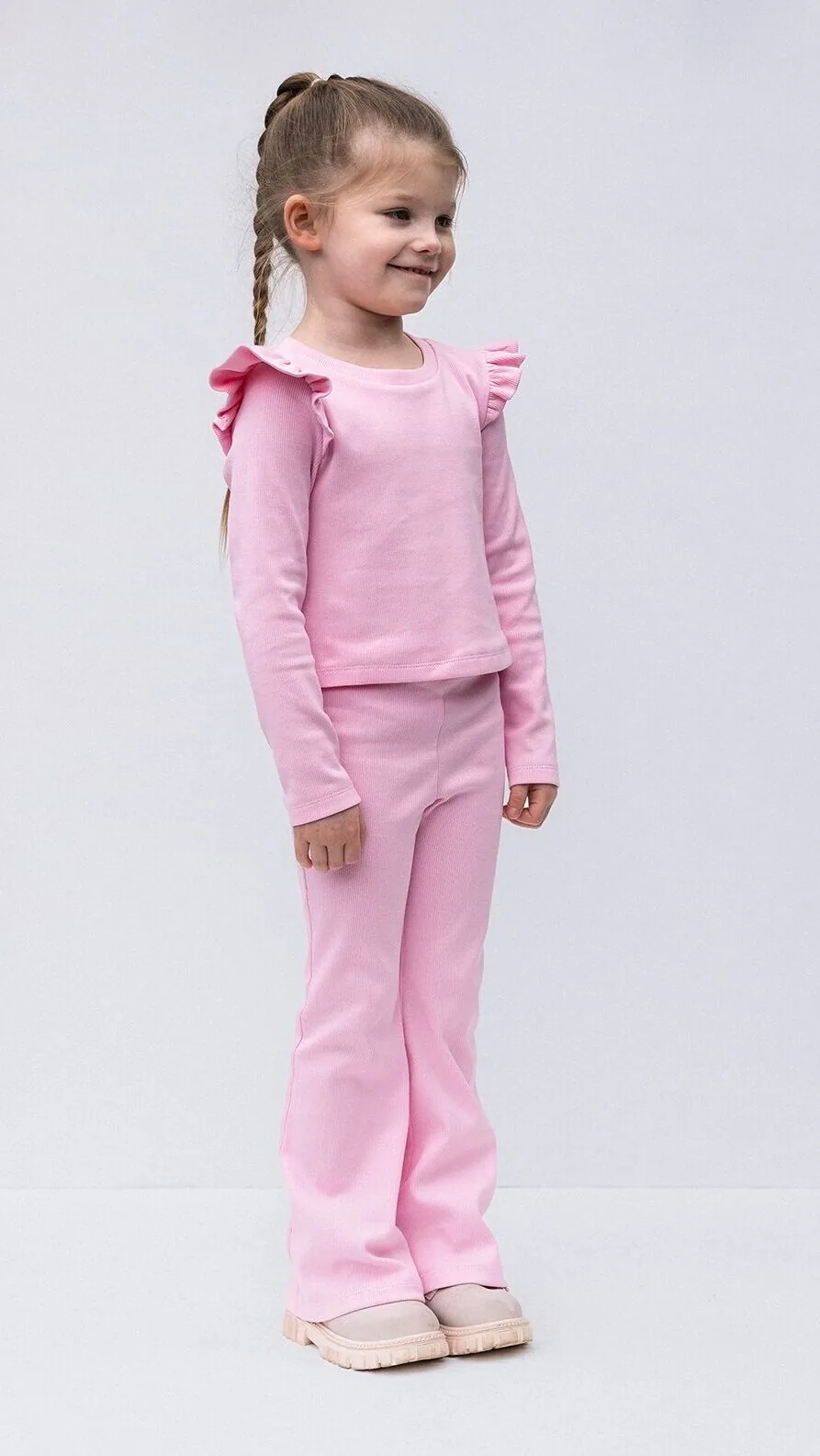 Long sleeve girls top with shoulder ruffle detail from Darling lounge set sewing pattern