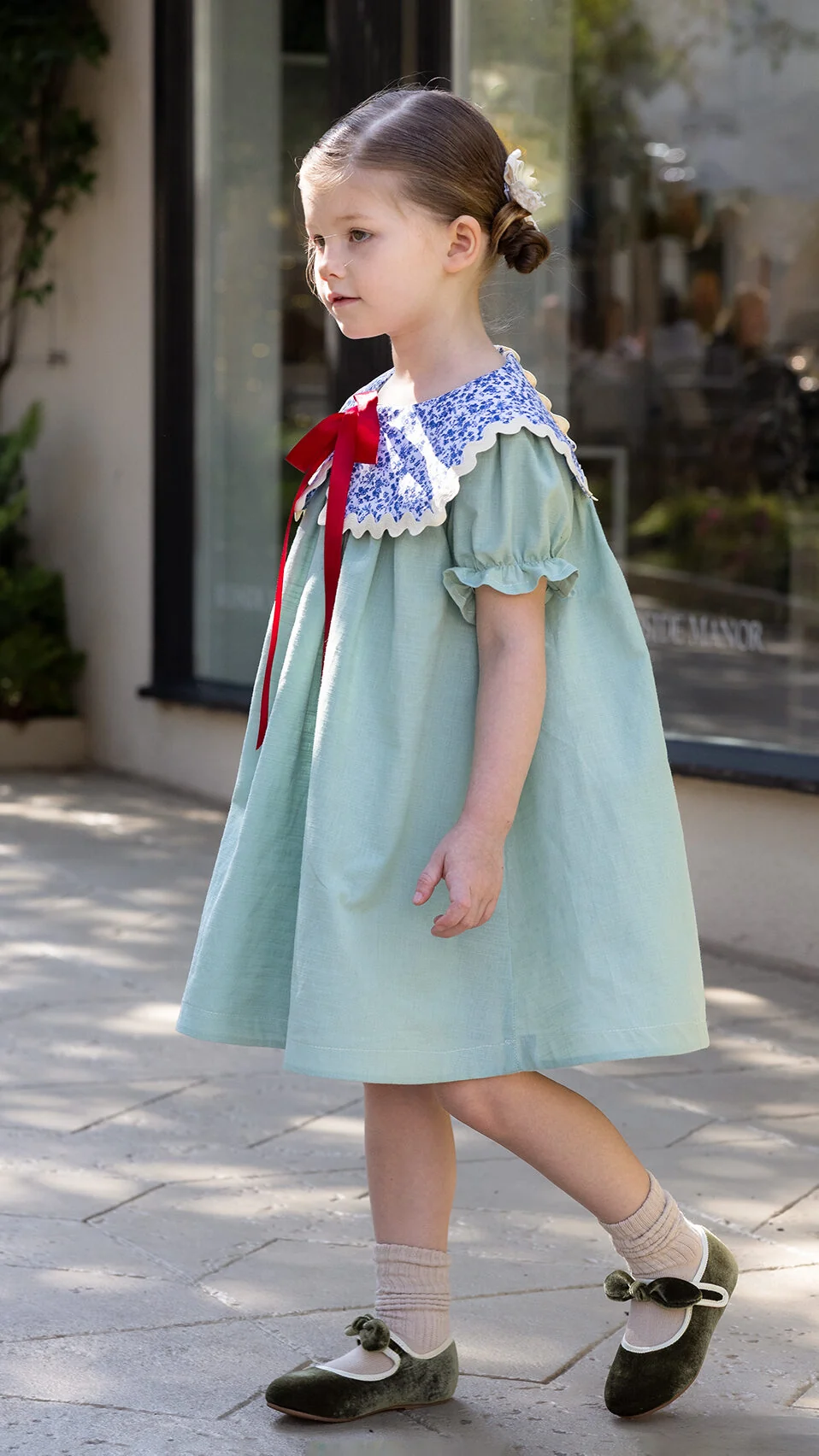 Classic children's dress sewing pattern featuring a modern oversized statement collar